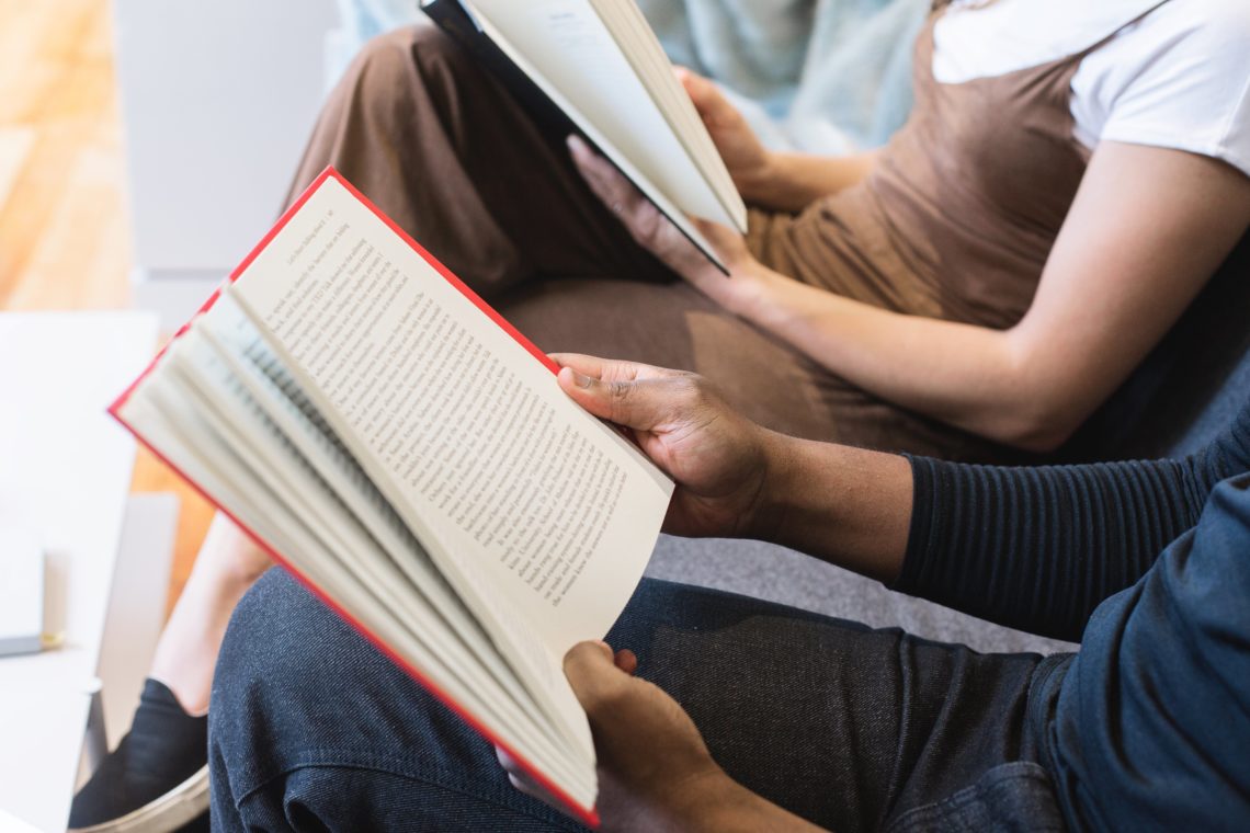 man woman reading