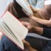 man woman reading